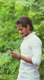 Young man using mobile phone