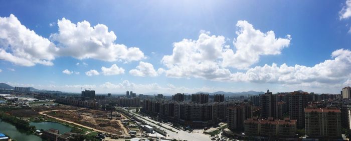 Panoramic view of cityscape against sky