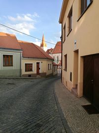 Houses against sky in city