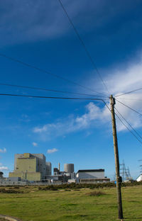 Low angle view of building against cloudy sky