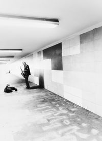 Man and woman walking in subway