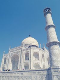 Low angle view of historic building against blue sky