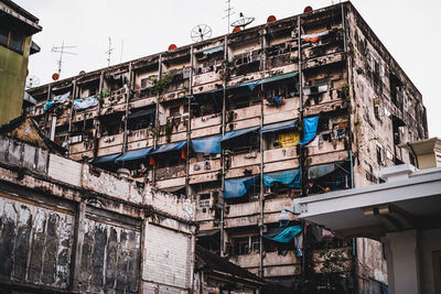 Low angle view of a downtown apartment building in bangkok, thailand.