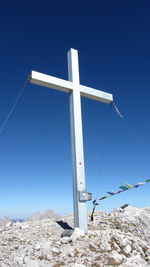 Low angle view of mountain against clear blue sky