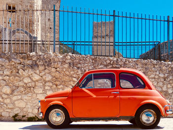 Vintage car against wall