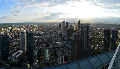 High angle view of modern buildings in city against sky