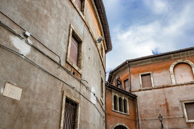 Low angle view of old building against sky