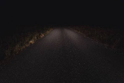Close-up of wet surface against sky at night