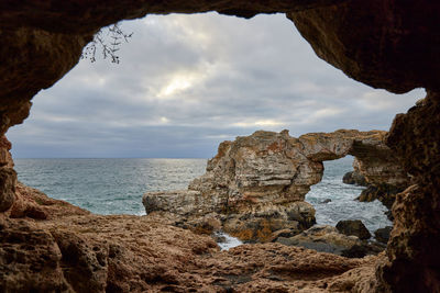 Natural rock arch in tulenovo seen from a cave - north bulgaria, black sea