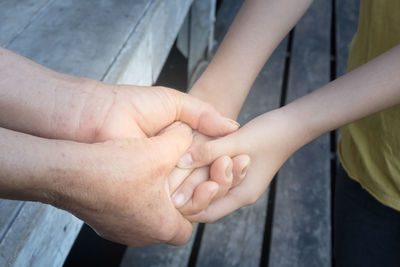 High angle view of people holding hands