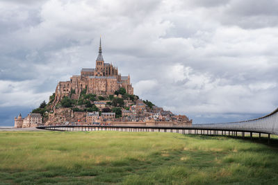 View of old building against cloudy sky