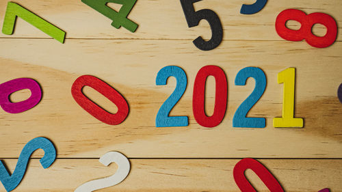 Close-up of multi colored text on table