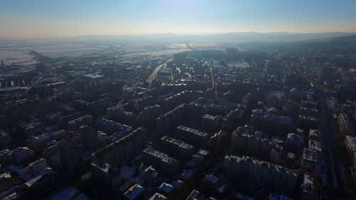 Aerial view of cityscape against sky