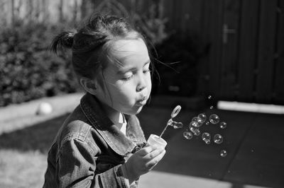 Girl looking at bubbles