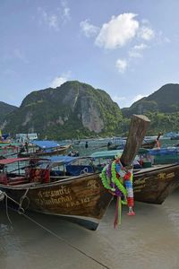 Calm sea with mountain range in background