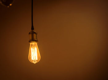 Close-up of illuminated light bulb