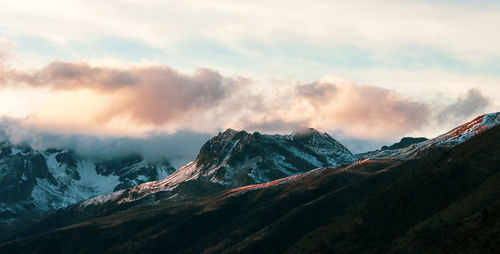 Scenic view of snowcapped mountains against sky