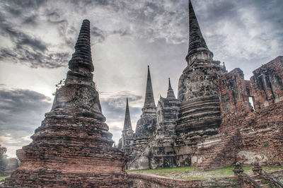 Low angle view of old temple building against sky