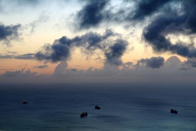 Scenic view of sea against cloudy sky