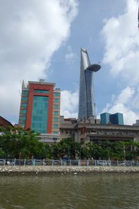 Buildings against cloudy sky