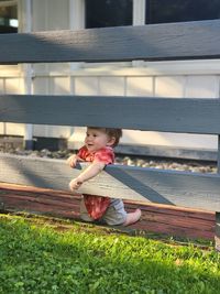 Summer fun, boy, baby, adventure, expiration , imagination, curiosity, fence, playtime, backyard