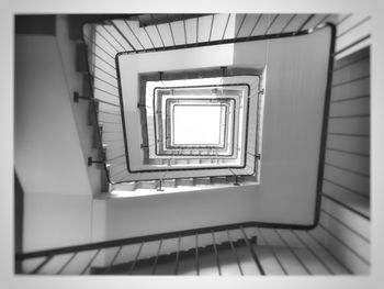 Directly below shot of spiral staircase of building