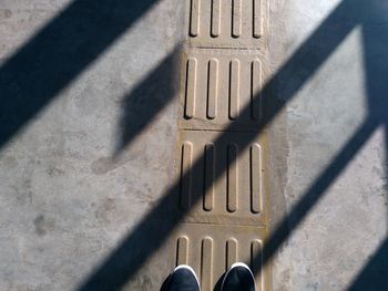 High angle view of person shadow on floor