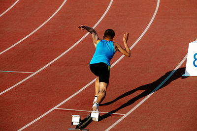 High angle view of man running on race track