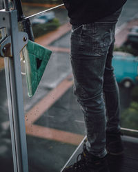 Low section of cleaner cleaning glass balcony