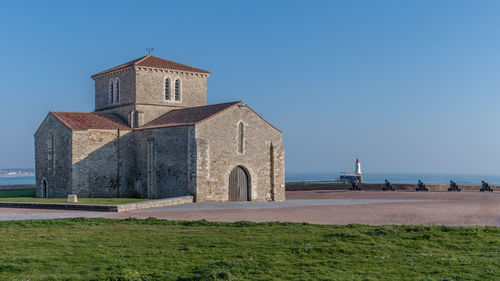 Historic building against clear blue sky