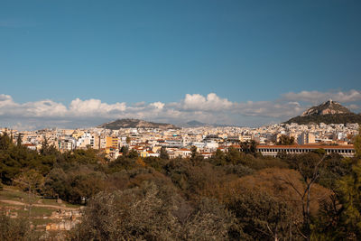 Buildings in city against sky