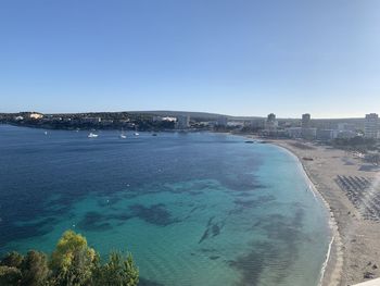 Scenic view of sea against clear blue sky