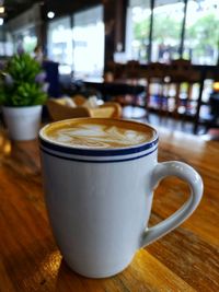 Close-up of coffee cup on table