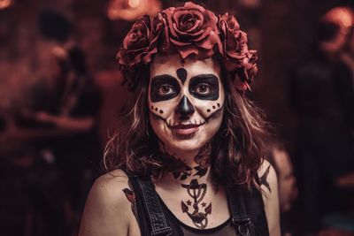 Close-up portrait of young woman in spooky make-up during halloween