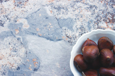 High angle view of chestnuts in bowl on table