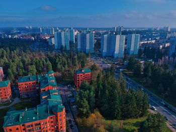 High angle view of buildings in city against sky