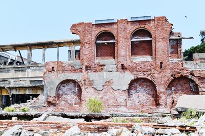 Low angle view of old ruins against clear sky