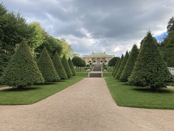 View of garden against cloudy sky
