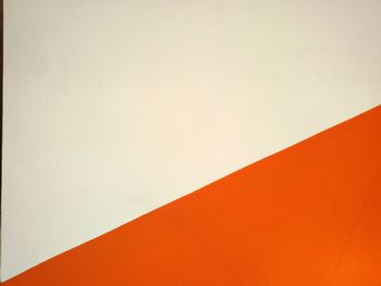 Low angle view of orange wall