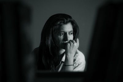 Portrait of young woman looking away