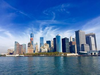 City skyline against cloudy sky