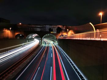 High angle view of light trails on road at night