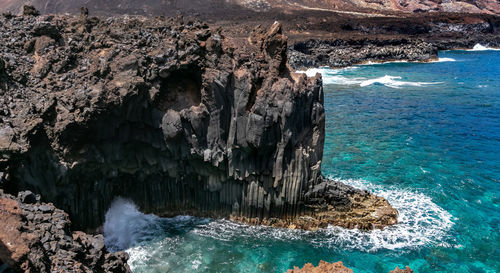 Panoramic view of rock formation in sea