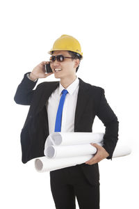 Mid section of man wearing hat against white background