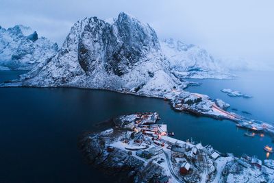 Scenic view of lake and snowcapped mountains during winter