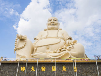 Low angle view of statue against sky