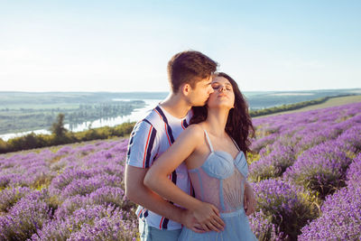 Loved people in a lavender field, a man and a woman love each other