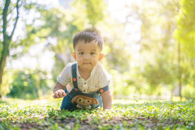 Portrait of cute boy on field