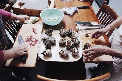 High angle view of people on table