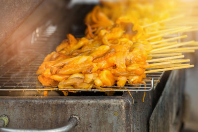 Close-up of food in skewer on barbecue grill